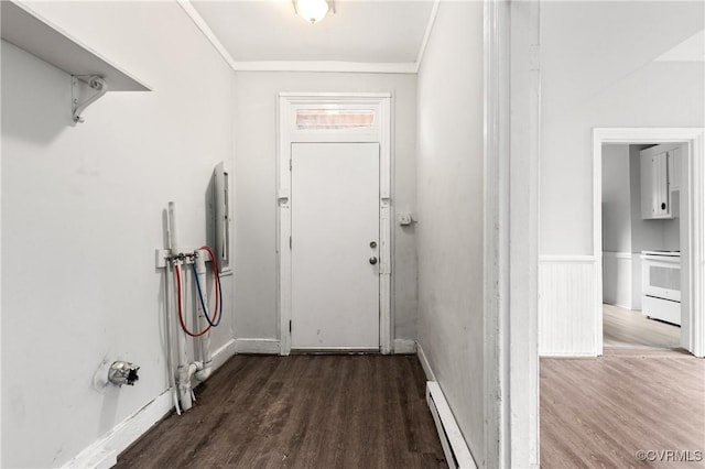 doorway with ornamental molding, a baseboard radiator, and wood finished floors