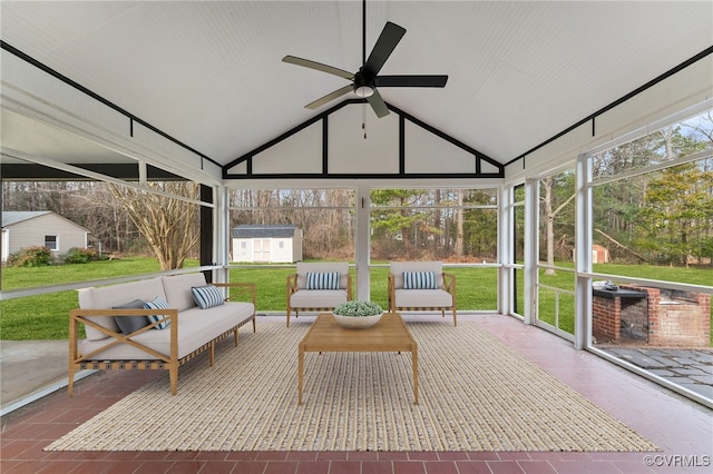 sunroom / solarium featuring lofted ceiling and a ceiling fan