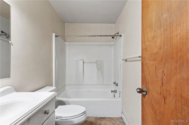 bathroom featuring bathing tub / shower combination, vanity, and toilet