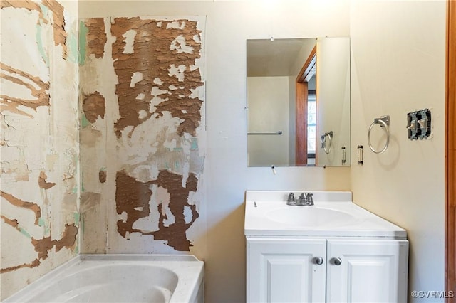 bathroom featuring a bathing tub and vanity