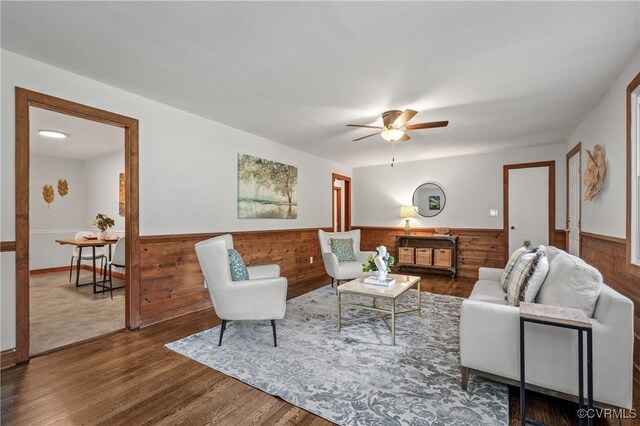 1909 Dinwiddie Ave, Hopewell, VA 23860 - living area featuring wainscoting, ceiling fan, wood finished floors, and wooden walls