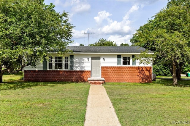 1909 Dinwiddie Ave, Hopewell, VA 23860 - view of front of home with brick siding and a front lawn
