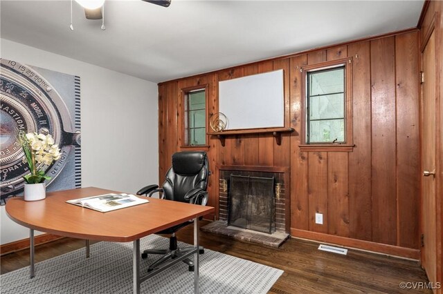 1909 Dinwiddie Ave, Hopewell, VA 23860 - office area featuring a fireplace, wooden walls, wood finished floors, and ceiling fan