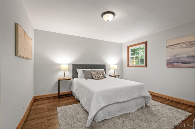 1909 Dinwiddie Ave, Hopewell, VA 23860 - bedroom featuring baseboards and wood finished floors