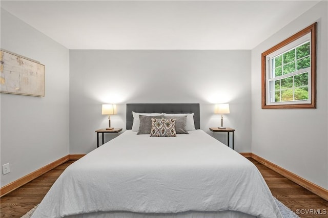 1909 Dinwiddie Ave, Hopewell, VA 23860 - bedroom featuring baseboards and dark wood finished floors