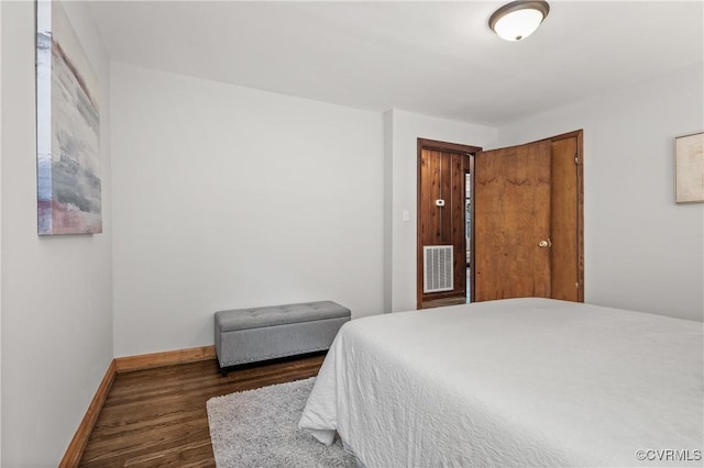 1909 Dinwiddie Ave, Hopewell, VA 23860 - bedroom with dark wood-type flooring and a closet