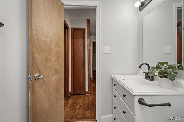 1909 Dinwiddie Ave, Hopewell, VA 23860 - bathroom with vanity and wood finished floors