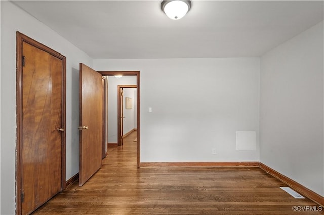 1909 Dinwiddie Ave, Hopewell, VA 23860 - spare room featuring wood finished floors and baseboards