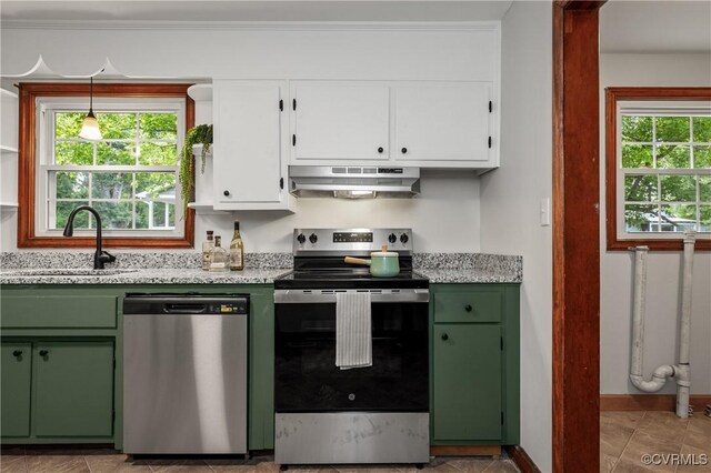 1909 Dinwiddie Ave, Hopewell, VA 23860 - kitchen featuring appliances with stainless steel finishes, range hood, green cabinets, white cabinetry, and light stone countertops