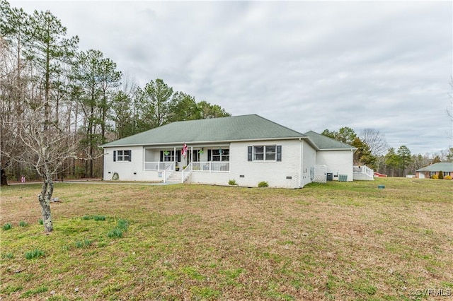 ranch-style home featuring crawl space, a porch, and a front yard