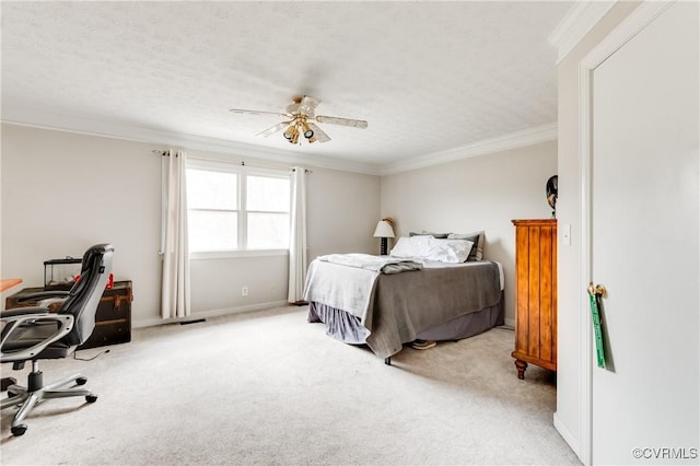 bedroom with carpet floors, a textured ceiling, and ornamental molding