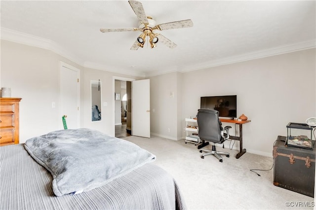 carpeted bedroom with a ceiling fan, baseboards, and ornamental molding