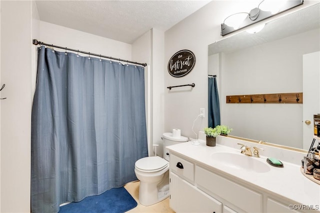 bathroom featuring vanity, toilet, a shower with curtain, and a textured ceiling