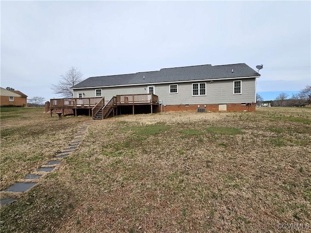 rear view of property with crawl space, central AC, and a wooden deck