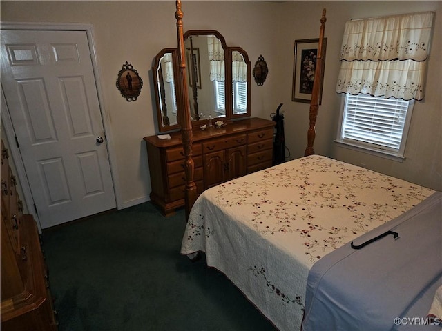 bedroom featuring dark carpet