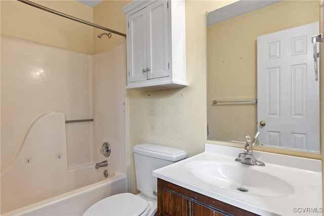 bathroom featuring shower / washtub combination, vanity, and toilet