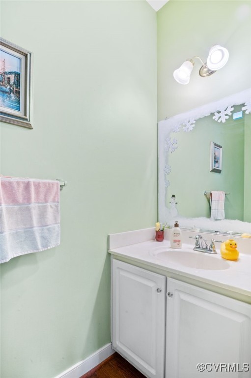 bathroom featuring baseboards and vanity