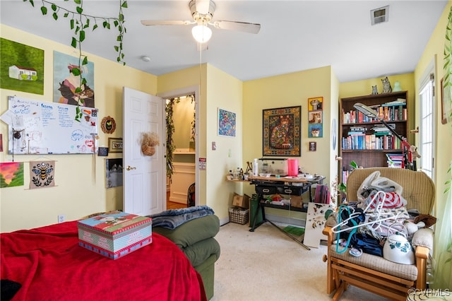 bedroom featuring carpet floors, visible vents, and ceiling fan