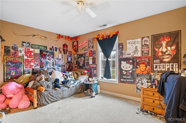 bedroom with carpet floors, visible vents, baseboards, and a ceiling fan