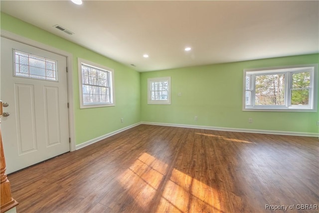 entryway featuring recessed lighting, wood finished floors, visible vents, and baseboards