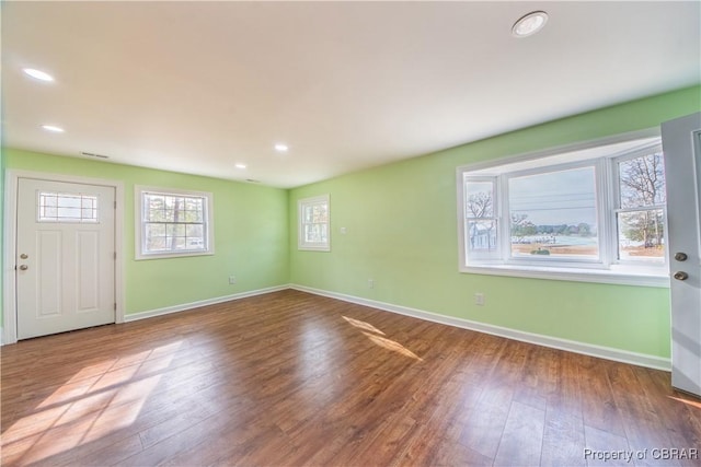 entryway with recessed lighting, wood finished floors, and baseboards