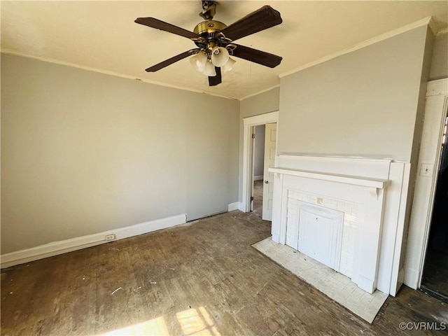 unfurnished living room with baseboards, wood finished floors, a ceiling fan, and crown molding