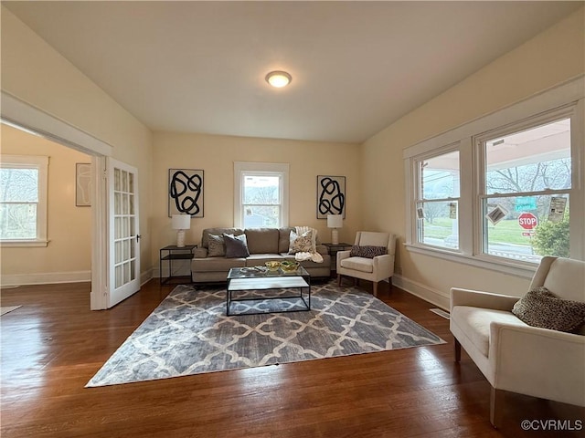 1934 Wood St, Richmond, VA 23223 - living room featuring french doors, baseboards, and dark wood finished floors