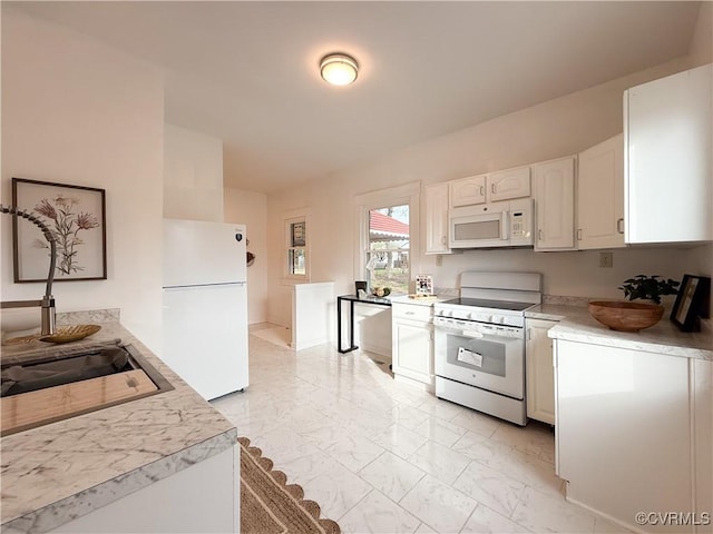 1934 Wood St, Richmond, VA 23223 - kitchen featuring white cabinetry, white appliances, light countertops, and marble finish floor