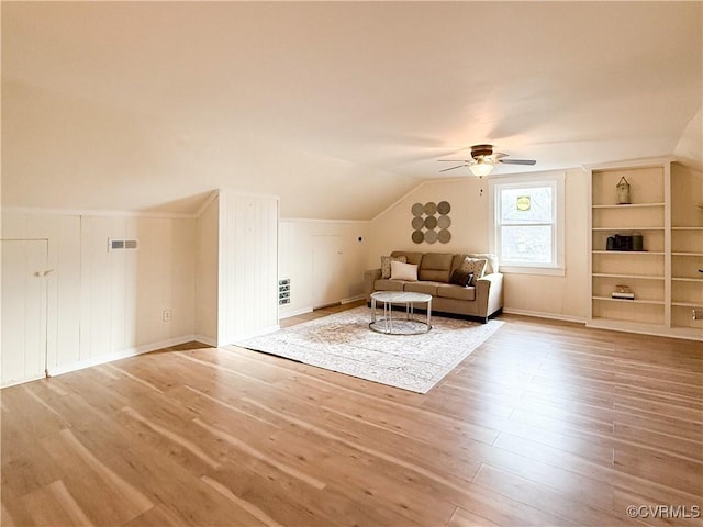 1934 Wood St, Richmond, VA 23223 - unfurnished room with visible vents, built in shelves, ceiling fan, vaulted ceiling, and wood finished floors