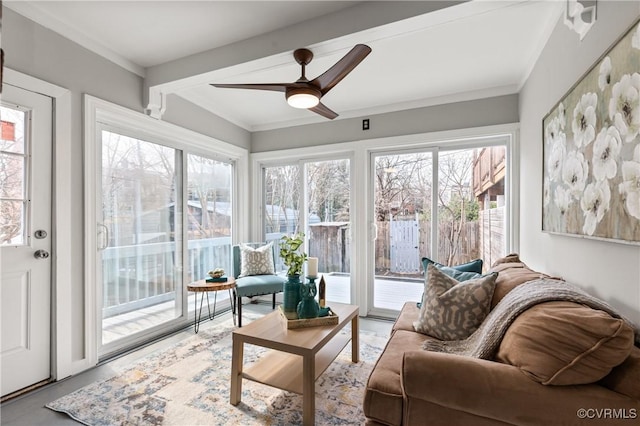 sunroom with a ceiling fan