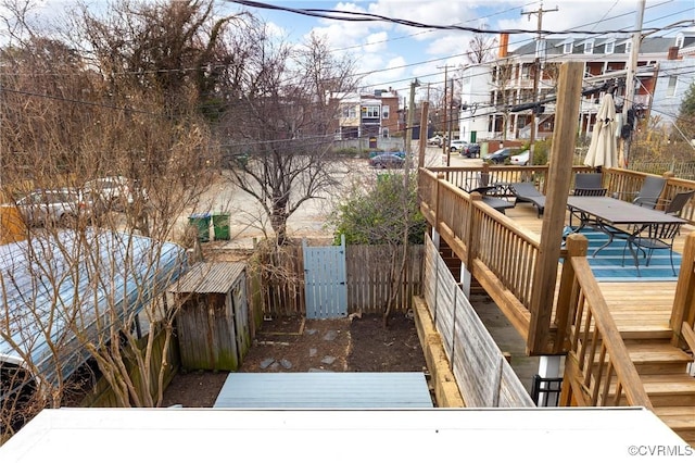 deck with a fenced backyard