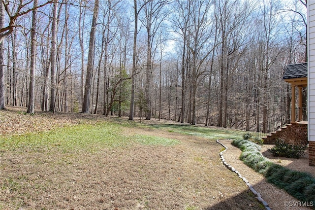 view of yard with a forest view