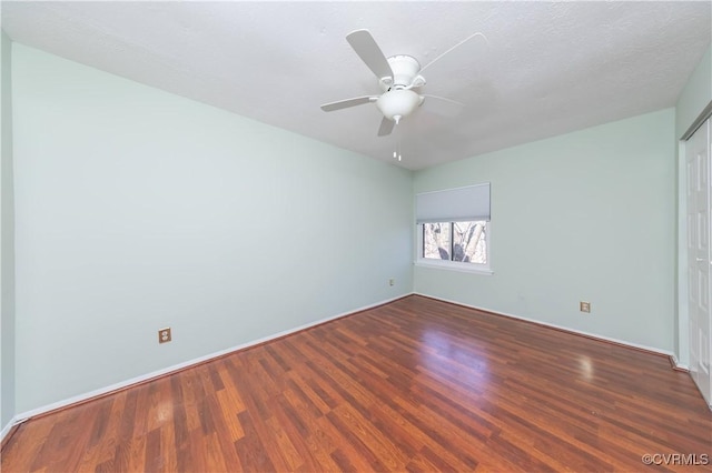 unfurnished room with wood finished floors and ceiling fan