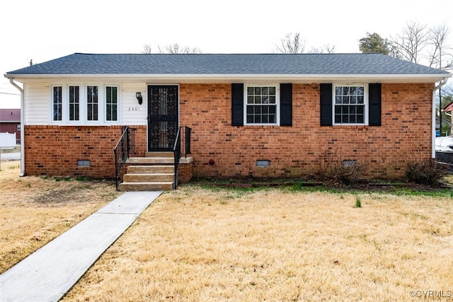 view of front of property featuring crawl space, a shingled roof, a front yard, and brick siding