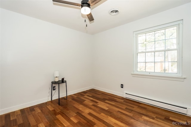 unfurnished room featuring baseboards, visible vents, ceiling fan, wood finished floors, and a baseboard heating unit