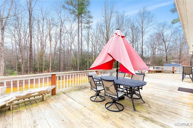 deck featuring outdoor dining space