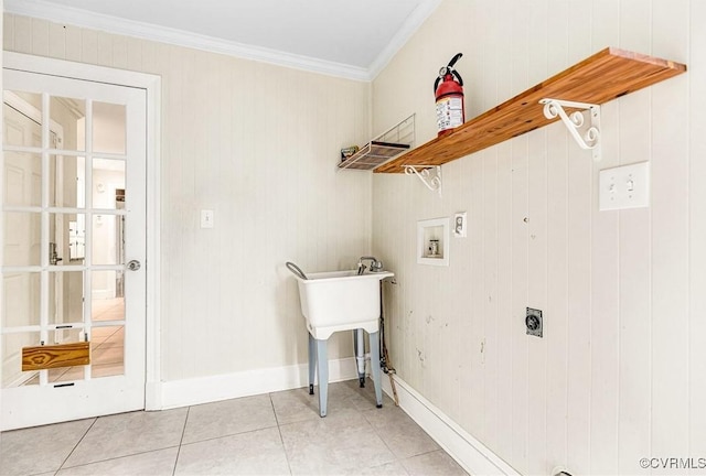 laundry room featuring laundry area, light tile patterned floors, crown molding, washer hookup, and electric dryer hookup