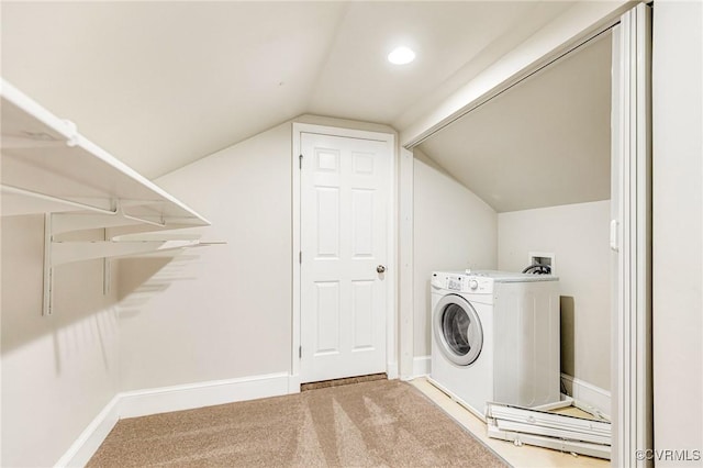 clothes washing area with washer / dryer, baseboards, laundry area, and carpet