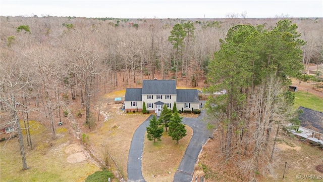 aerial view featuring a view of trees