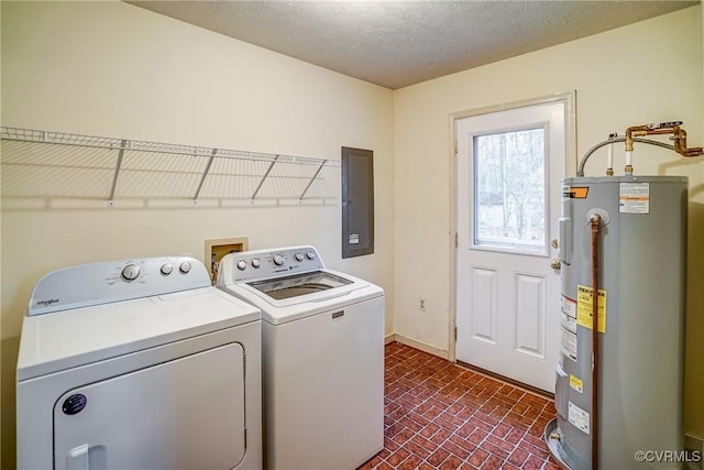 laundry area with laundry area, electric panel, brick floor, washing machine and dryer, and water heater