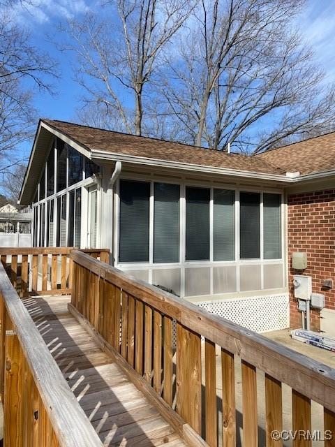 exterior space featuring a sunroom