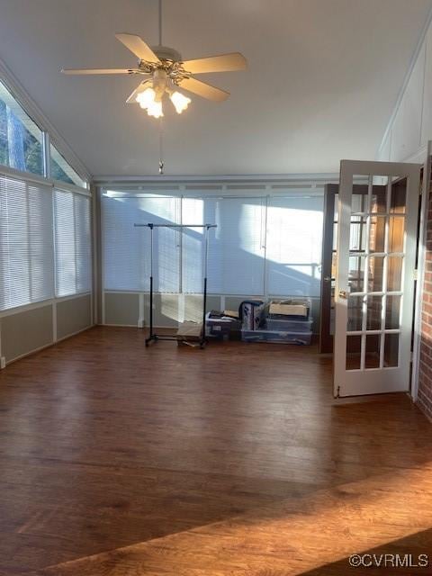 interior space featuring plenty of natural light, a ceiling fan, and wood finished floors