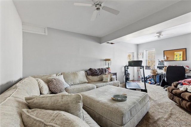 carpeted living area with ceiling fan