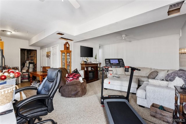 workout room featuring visible vents, carpet, and ceiling fan