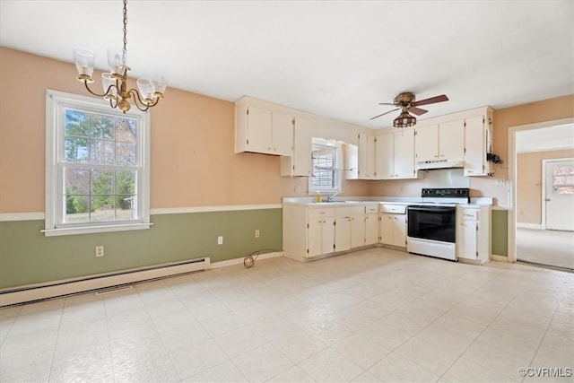 kitchen with electric stove, light countertops, a baseboard heating unit, under cabinet range hood, and ceiling fan with notable chandelier