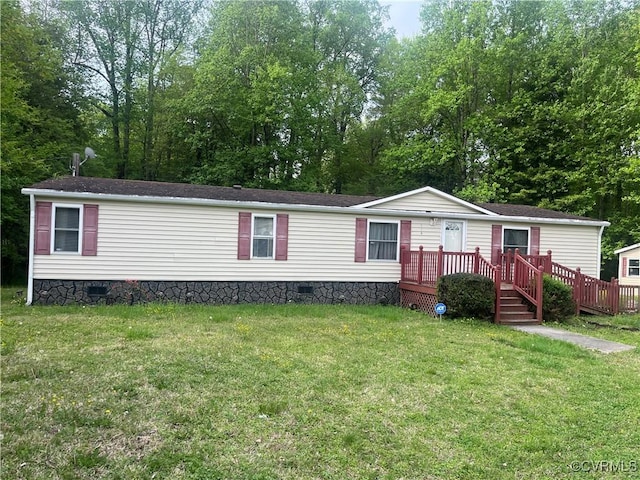 manufactured / mobile home featuring crawl space, a front yard, and a deck
