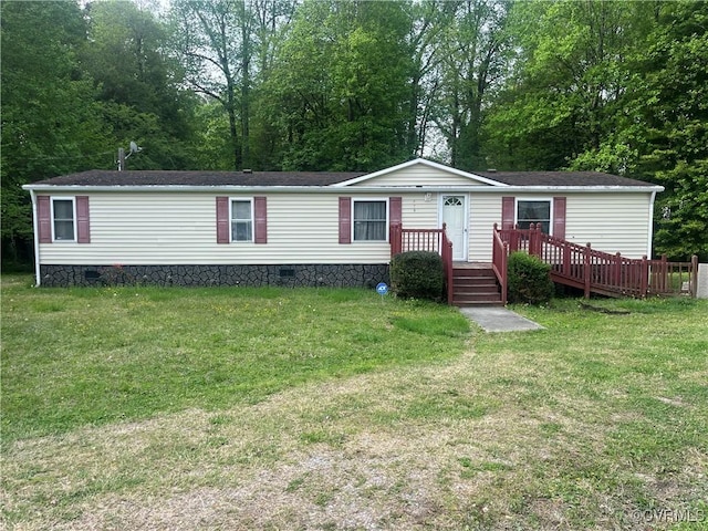 manufactured / mobile home with crawl space, a shingled roof, and a front yard