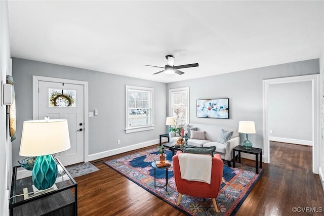 living area with ceiling fan, wood finished floors, and baseboards