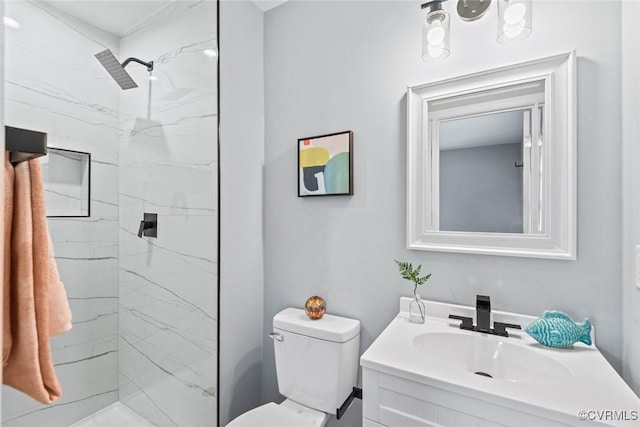 full bathroom with toilet, a marble finish shower, and vanity