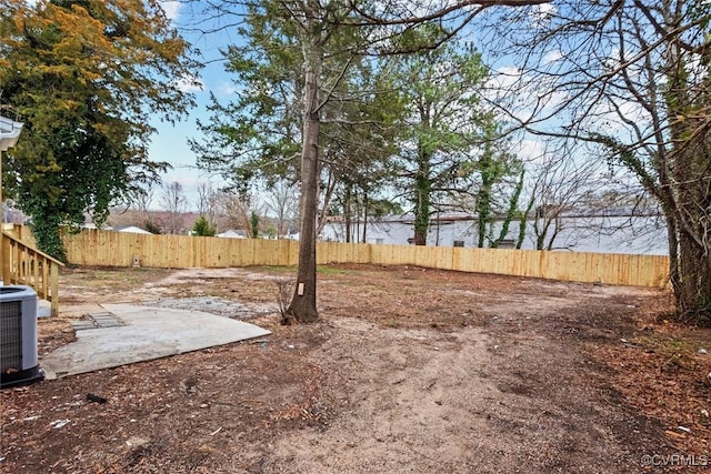 view of yard featuring cooling unit, a patio, and fence private yard